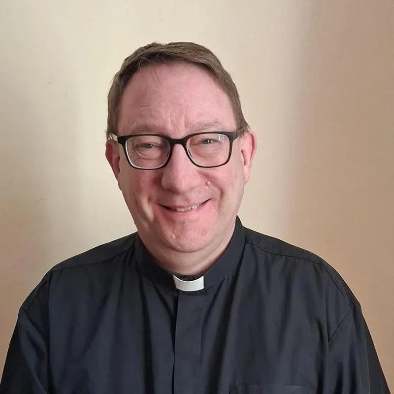 Portrait of Fr Nigel Woollen in clerical collar